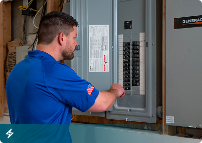 Electrical services: Academy Air electrician working at an open breaker panel