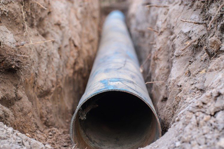 A clogged water line on a residential property in Chesterfield, MO has been excavated and repaired by professional plumbers. For water line repair and drain cleaning, contact your local plumbers.